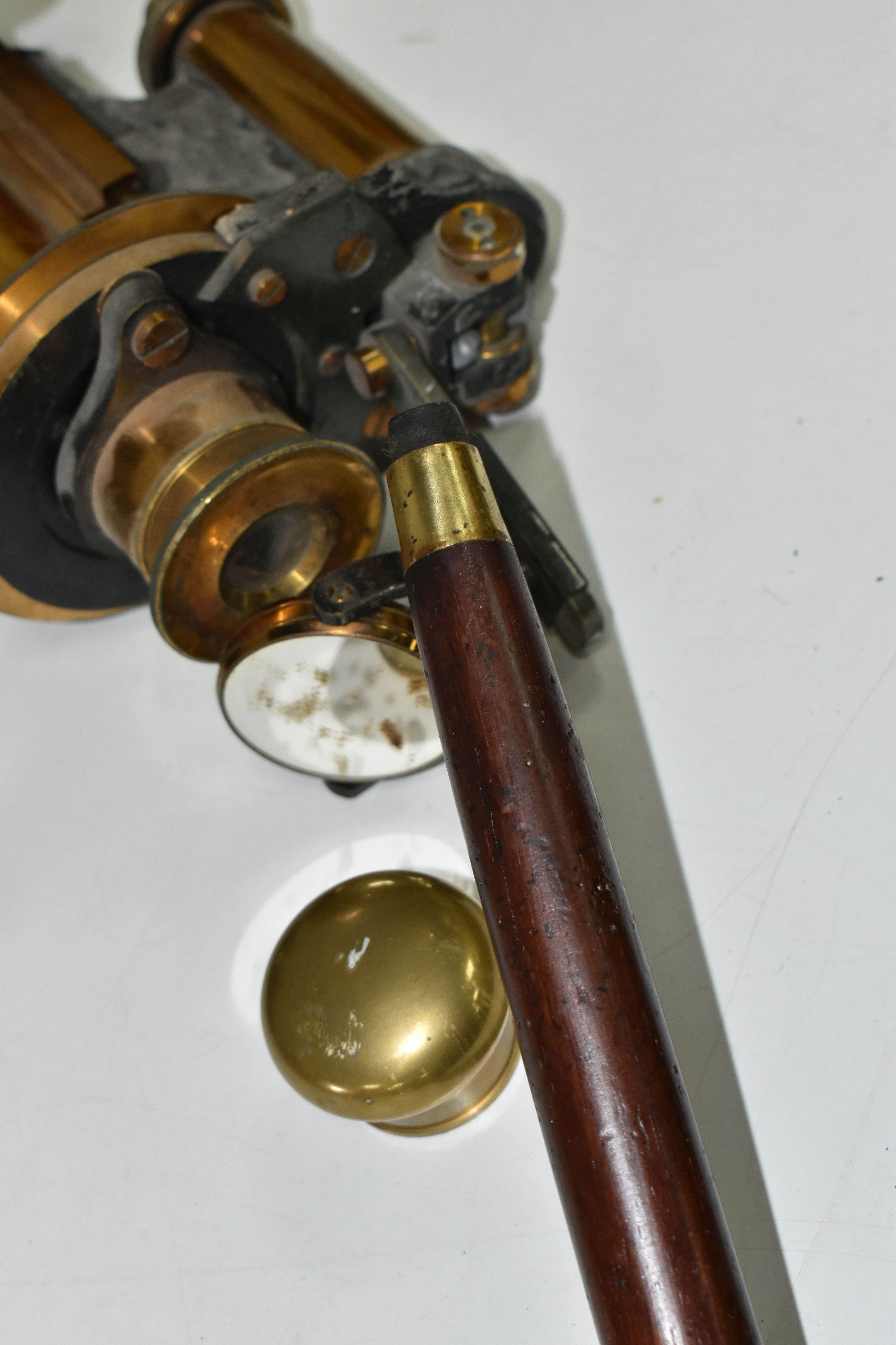 A REPRODUCTION WALKING CANE FITTED WITH BRASS TELESCOPE, length with telescope open 92cm, together - Image 7 of 8