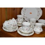 A PARAGON 'FIRST CHOICE' PATTERN TEA SET, comprising cake plate, five cups, sugar bowl, milk jug,