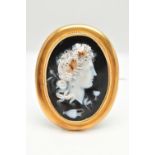 A LARGE YELLOW METAL CAMEO BROOH, glass cameo depicting a lady in profile with grapes in hair,