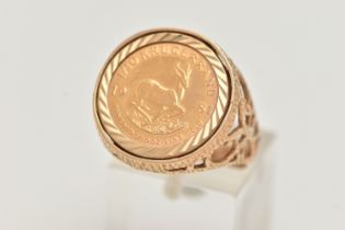 A KRUGERRAND 1/10th RING, a 1981 Krugerrand 1/10 coin, mounted in a textured open work ring mount