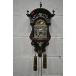 A WARMINK WUBA STYLE DUTCH WALL CLOCK, the arched top with three finials, above scrolled details,