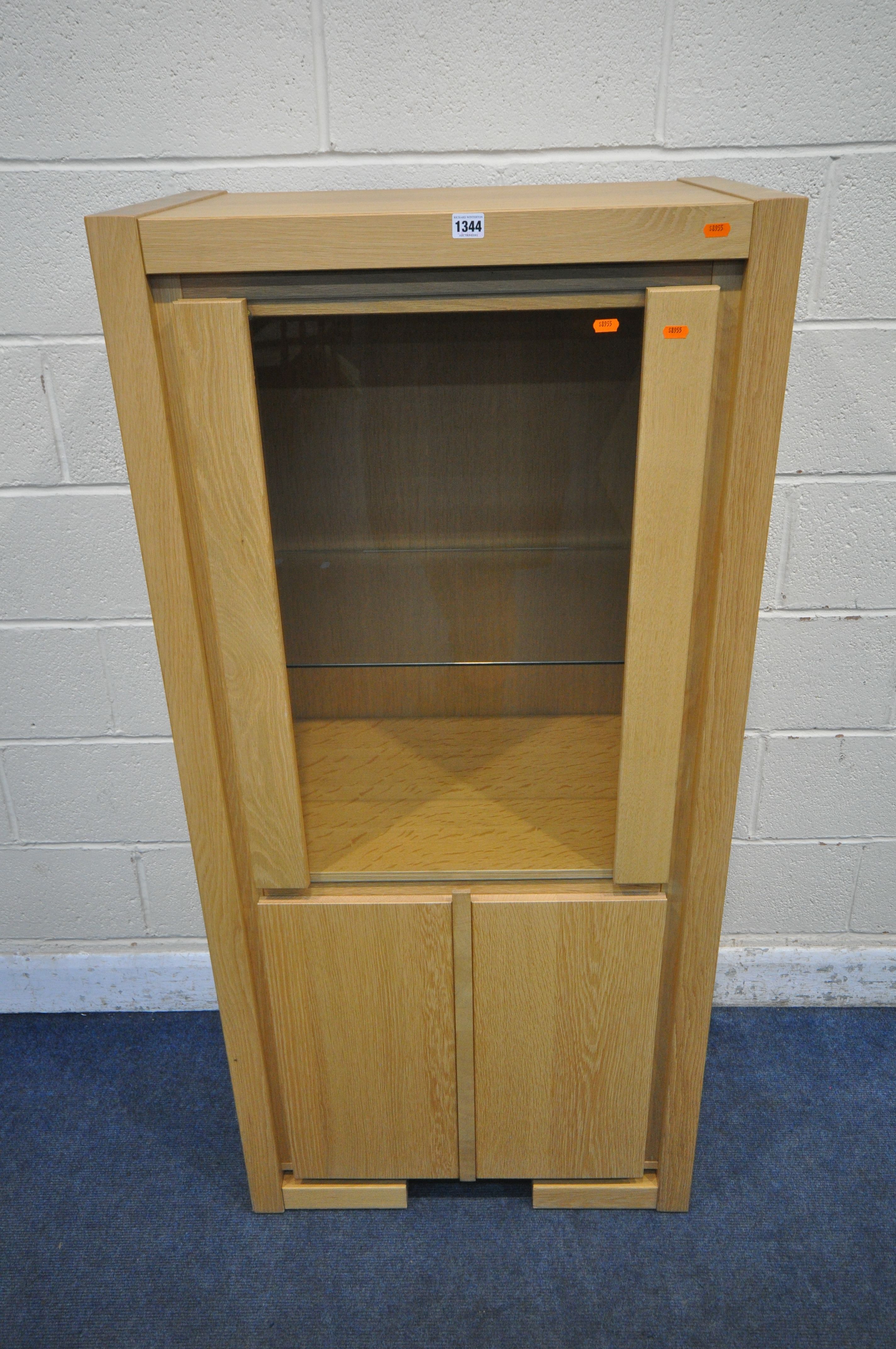 KAREL MINJTENS, A LIGHT OAK 'QUBA' CABINET, with a single glazed door, that's enclosing a single