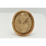 A YELLOW METAL, HIGH RELIEF LAVA CAMEO BROOCH, of an oval form, depicting a lady in profile,