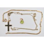 THREE ITEMS OF JEWELLERY, to include a yellow metal, gem set cross pendant suspended from a fine