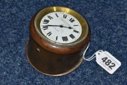 A SMALL CLOCK SWISS MADE FOR S.SMITH & SON LTD. 8-day motor clock in brass case, stamped 370, with