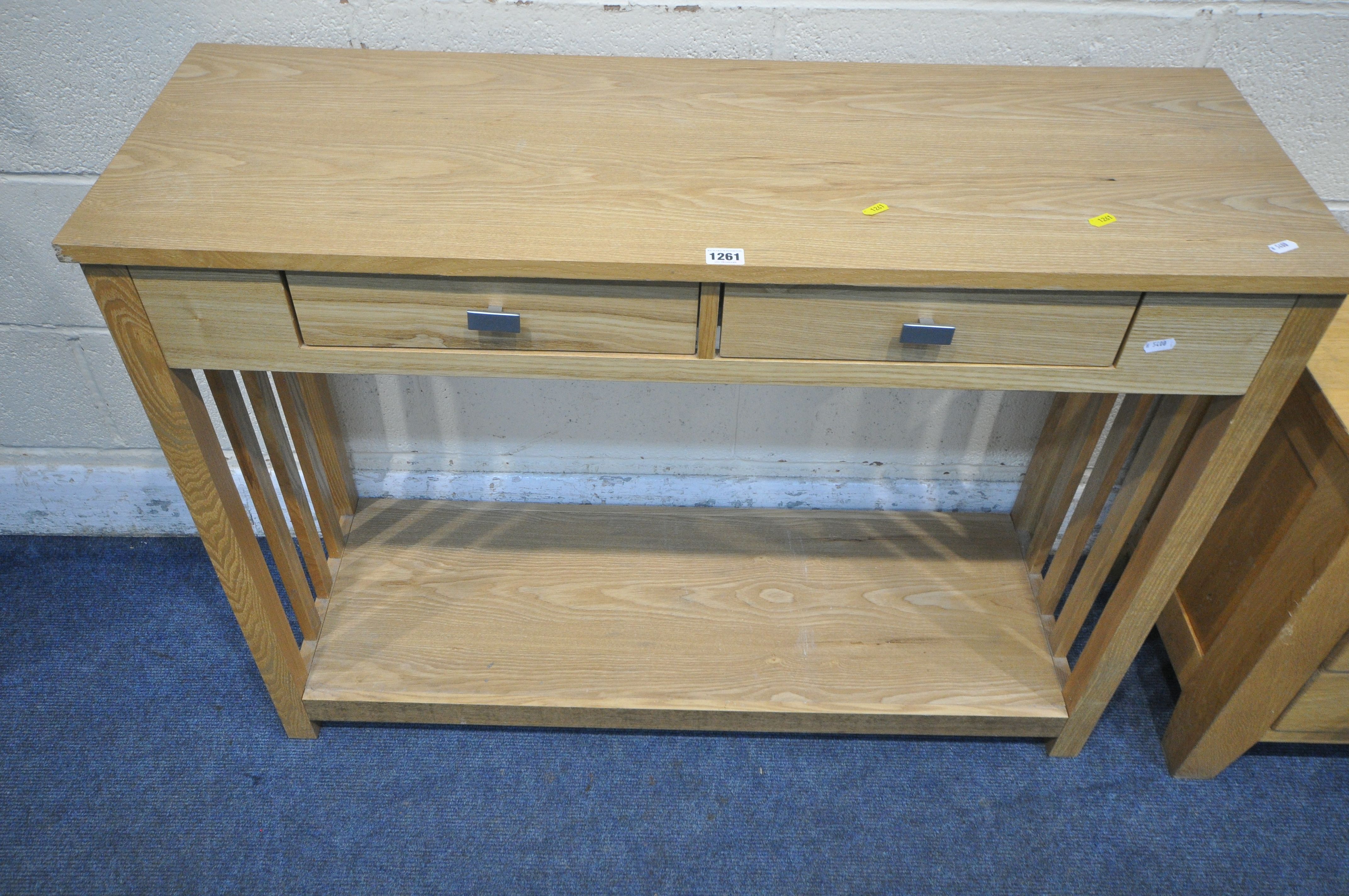 A MODERN OAK EFFECT SIDE TABLE, with two frieze drawers, raised on block supports, united by an - Image 2 of 3