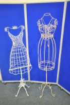 TWO WIRE DRESS MANNEQUINS, each on a pole support and four scrolled legs, tallest height 162cm (