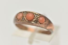 A LATE VICTORIAN 9CT GOLD, THREE STONE CORAL RING, set with three circular cut coral cabochons, with