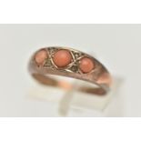 A LATE VICTORIAN 9CT GOLD, THREE STONE CORAL RING, set with three circular cut coral cabochons, with