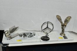 FOUR CAR MASCOTS MOUNTED ON GRANITE BASES, comprising Rolls Royce, Mercedes, Jaguar and Bentley,