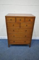 A REPRODUCTION HARDWOOD CHEST OF EIGHT ASSORTED DRAWERS, on block legs, width 90cm x depth 53cm x