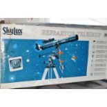 A BOXED 'SKYLUX' REFACTOR TELESCOPE, 70m f/7 on an equatorial mount and tripod, with instructions