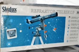 A BOXED 'SKYLUX' REFACTOR TELESCOPE, 70m f/7 on an equatorial mount and tripod, with instructions