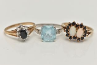 THREE GEM SET RINGS, the first a 9ct yellow gold, double cluster ring, set with two oval cut opal