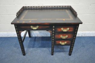 A 20TH CENTURY ORIENTAL BLACK PAINTED OAK DESK, with gold details, a raised gallery, fitted with