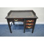 A 20TH CENTURY ORIENTAL BLACK PAINTED OAK DESK, with gold details, a raised gallery, fitted with