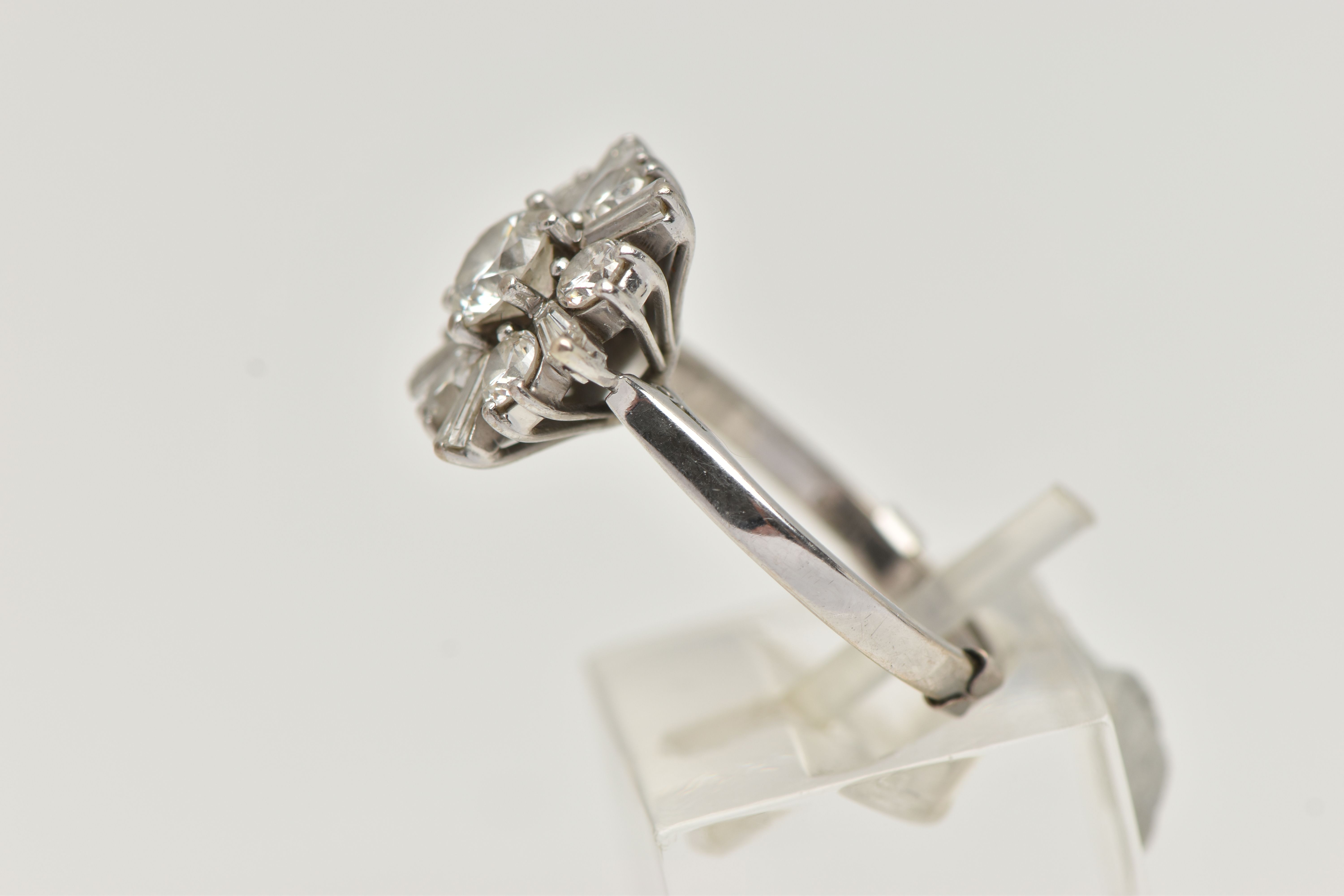 AN 18CT WHITE GOLD DIAMOND CLUSTER RING, centering on a round brilliant cut diamond, estimated - Image 2 of 4