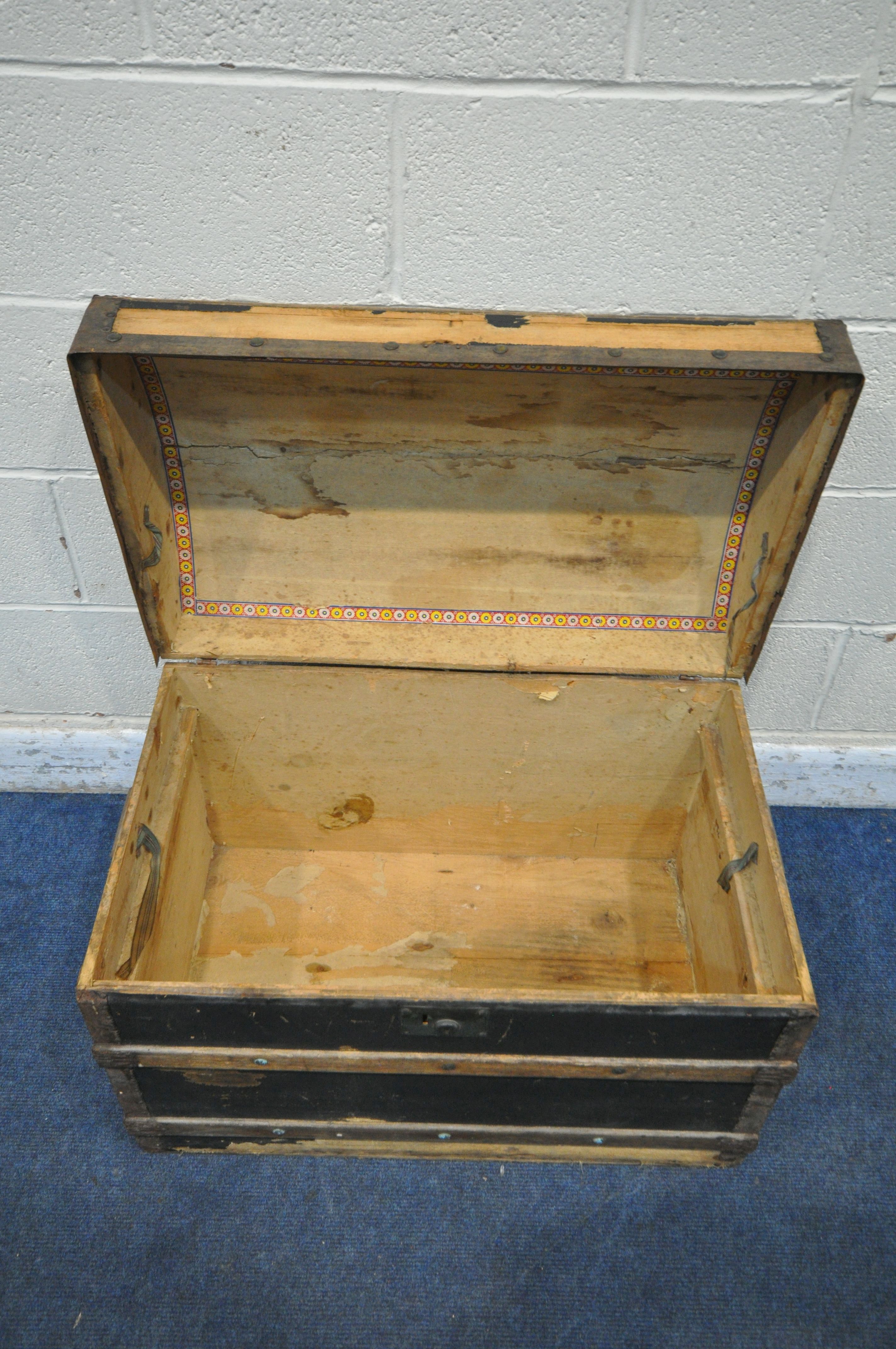 A DOMED TRAVELING TRUNK, with wooden and metal banding, twin handles and a hinged lid, width 77cm - Image 4 of 4