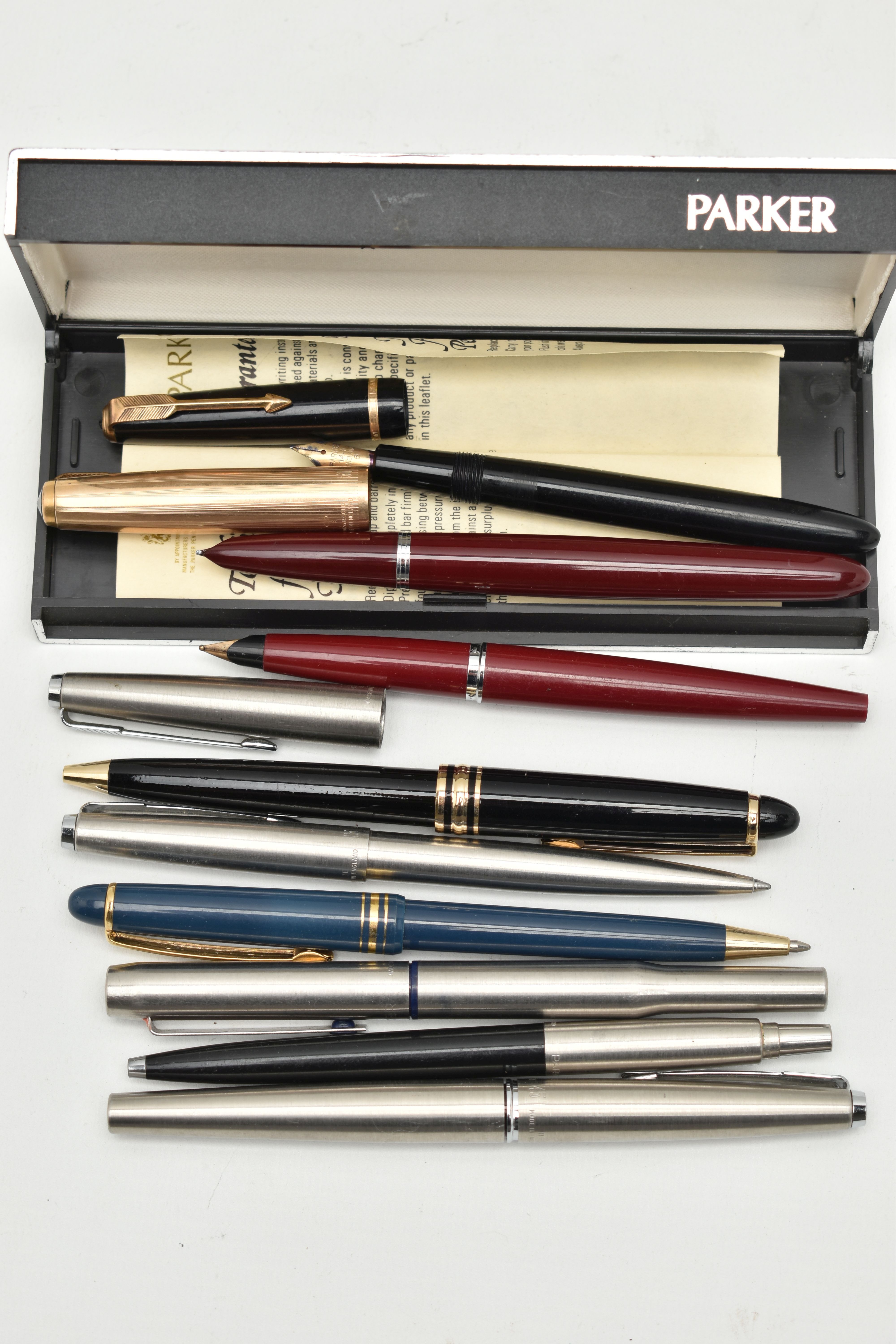 AN ASSORTMENT OF PENS, to include to 'Parker' fountain pens with yellow metal nibs, one stamped 14k,