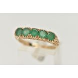 A 9CT GOLD FIVE STONE EMERALD RING, five circular cut emeralds, each claw set, scrolling gallery and