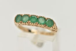 A 9CT GOLD FIVE STONE EMERALD RING, five circular cut emeralds, each claw set, scrolling gallery and