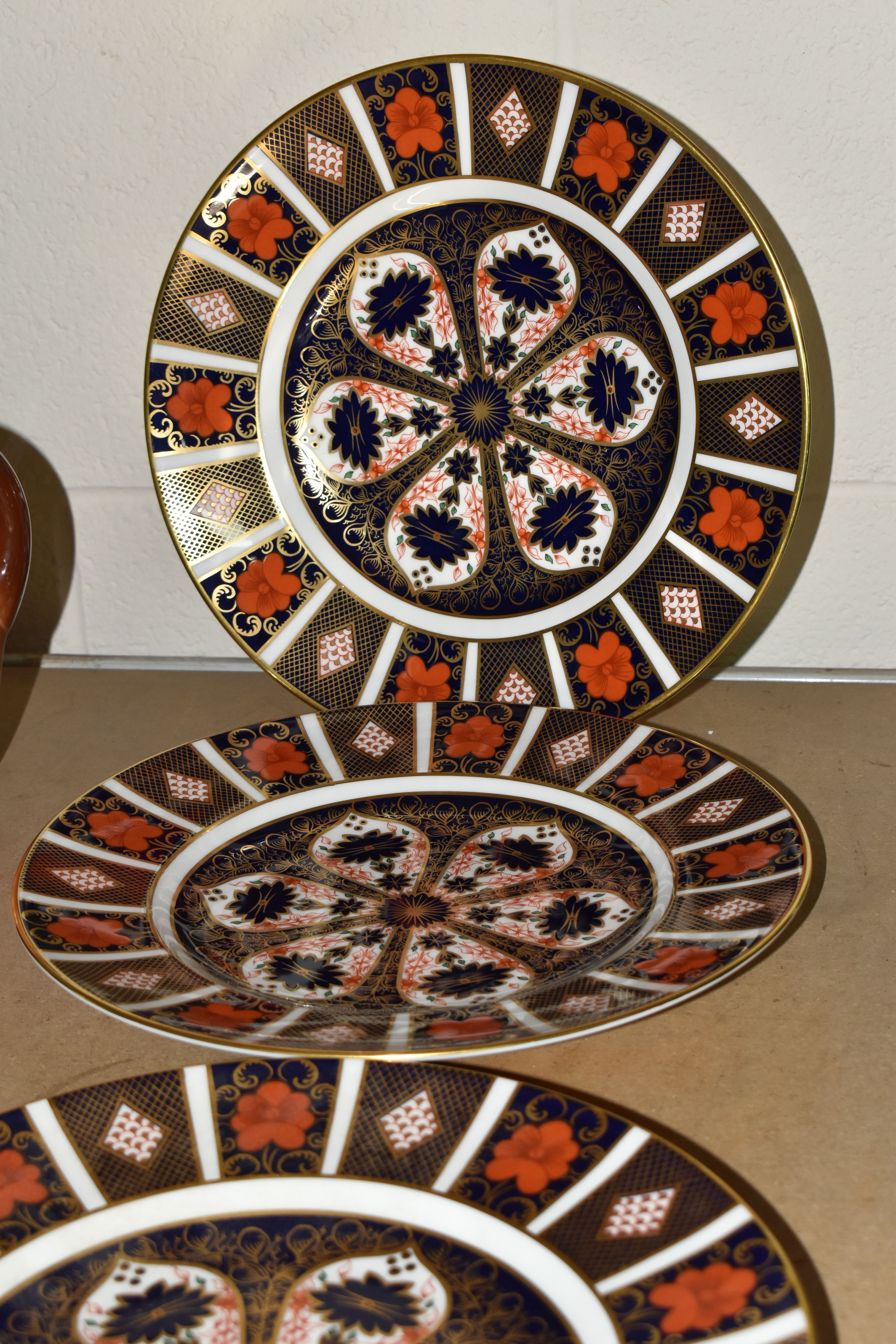 FOUR ROYAL CROWN DERBY IMARI 1128 PATTERN DINNER PLATES, bearing Roman numerals XLIII, XLIV and XLV,