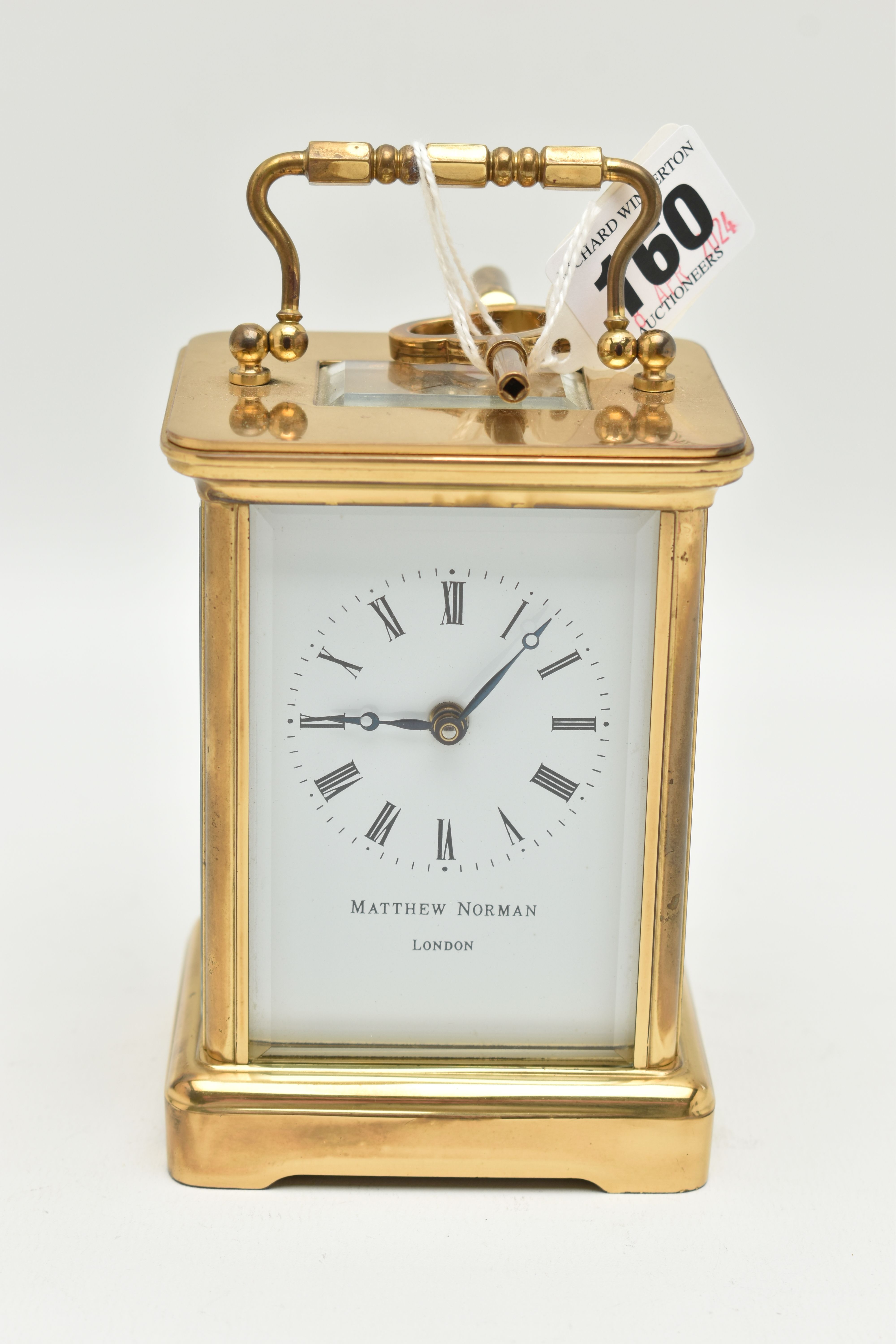 A 'MATTHEW NORMAN' CARRIAGE CLOCK, key wound, white Roman numeral dial signed 'Matthew Norman,
