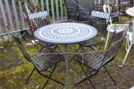 A STEEL AND TILED TOP GARDEN TABLE with four similar folding chairs table diameter 90cm