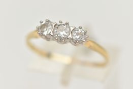 A YELLOW METAL THREE STONE DIAMOND RING, three round brilliant cut diamonds, each claw set,