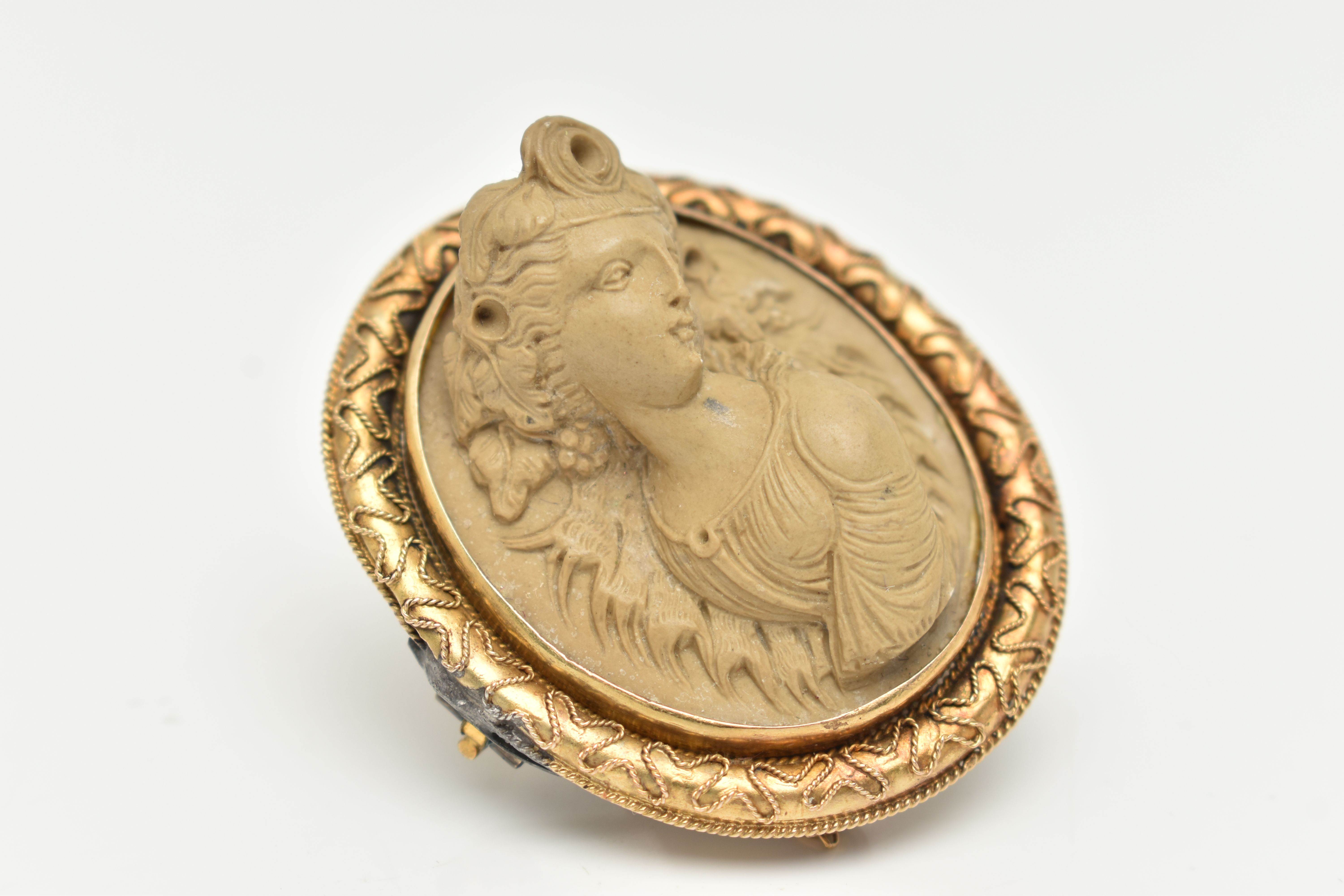 A YELLOW METAL, HIGH RELIEF LAVA CAMEO BROOCH, of an oval form, depicting a lady in profile, - Image 2 of 4