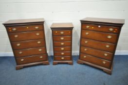 A PAIR OF STAG MAHOGANY CHESTS OF FIVE DRAWERS, width 82cm x depth 46cm x height 116cm, along with a