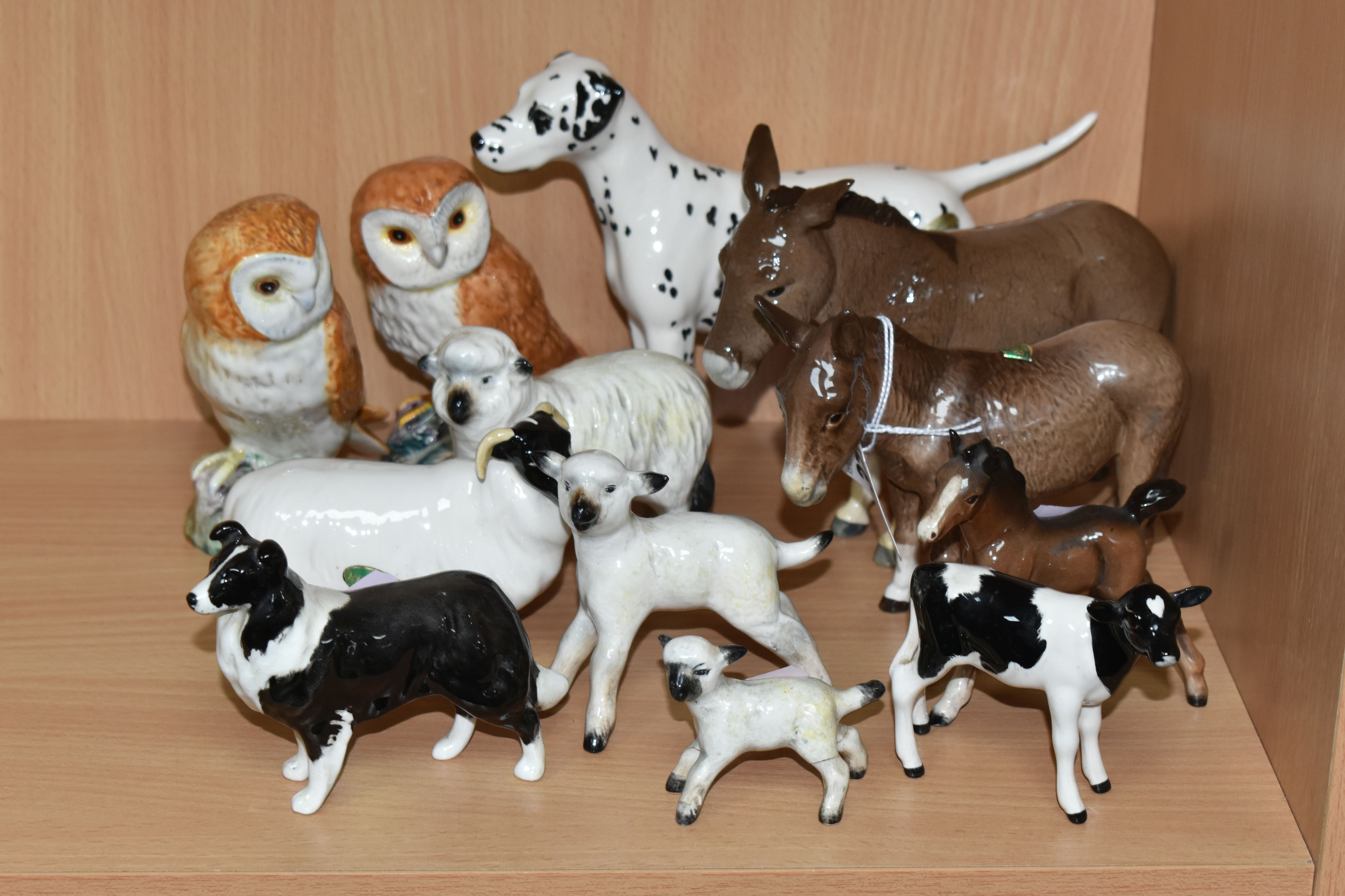 A GROUP OF BESWICK ANIMALS, comprising two donkeys, Donkey foal, height 11cm and Donkey no.2267A,