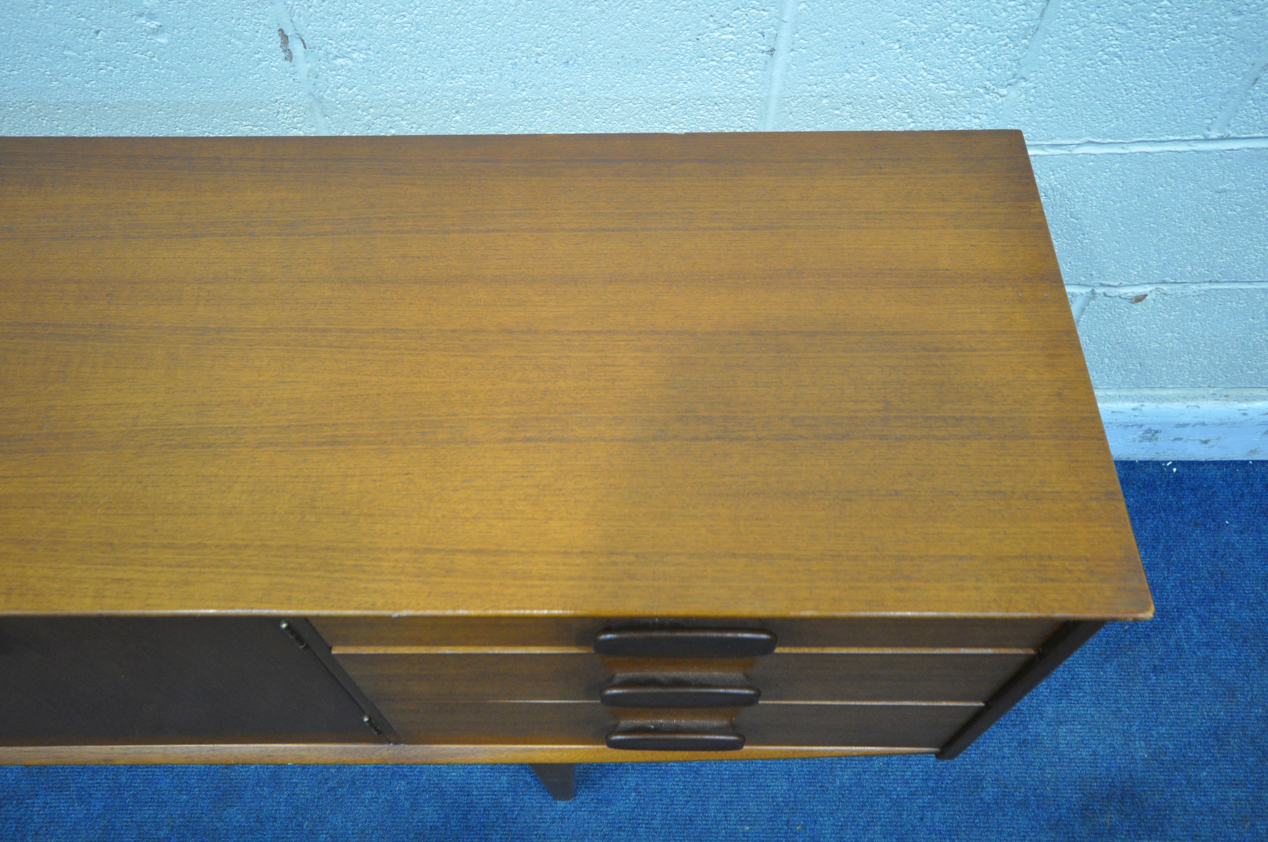 A MID CENTURY JENTIQUE TEAK SIDEBOARD, with three drawers, two cupboard doors and a fall front door, - Image 3 of 6
