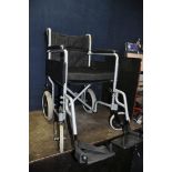AN ANGEL MOBILITY FOLDING WHEEL CHAIR with seat pad and two footrests