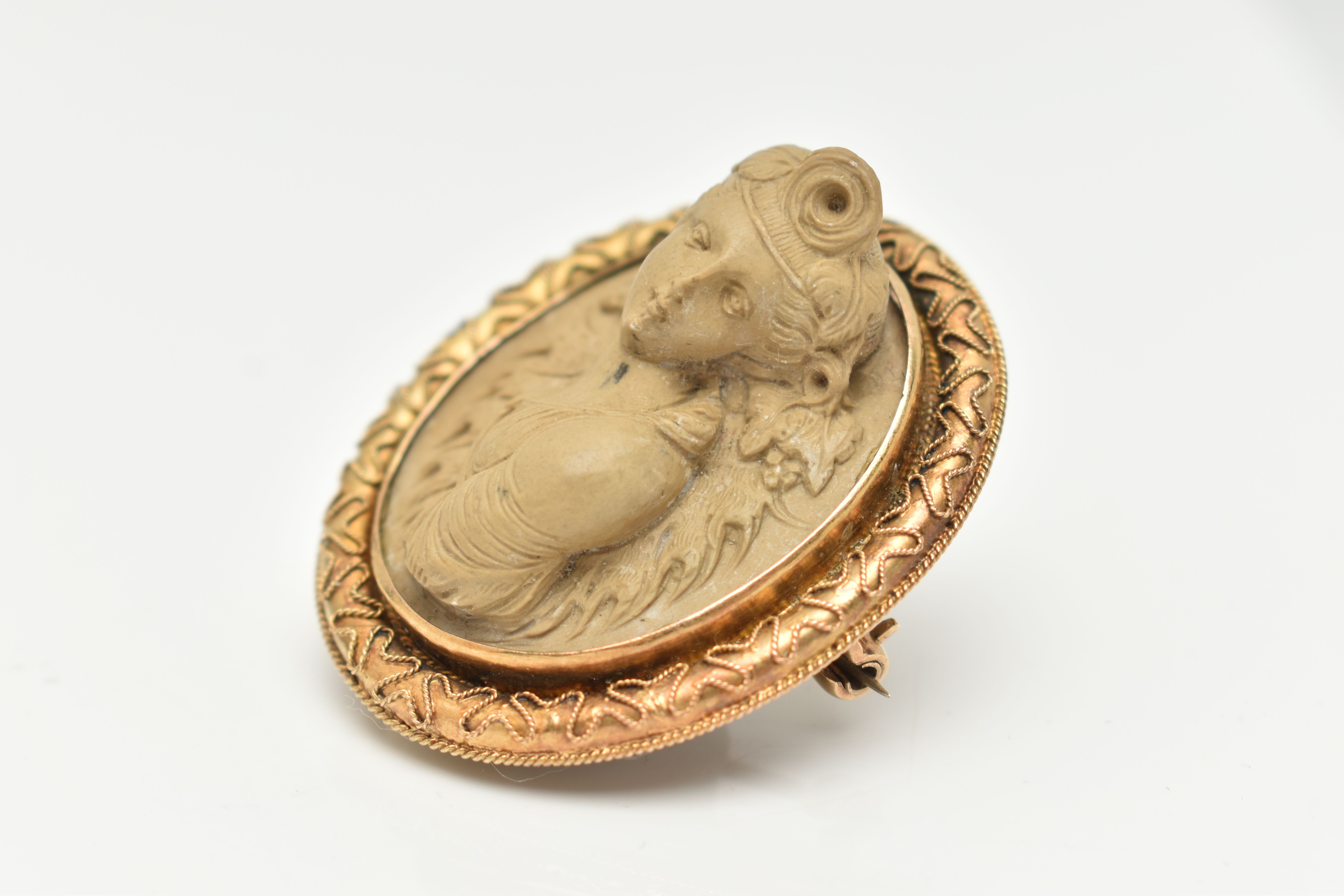 A YELLOW METAL, HIGH RELIEF LAVA CAMEO BROOCH, of an oval form, depicting a lady in profile, - Image 3 of 4