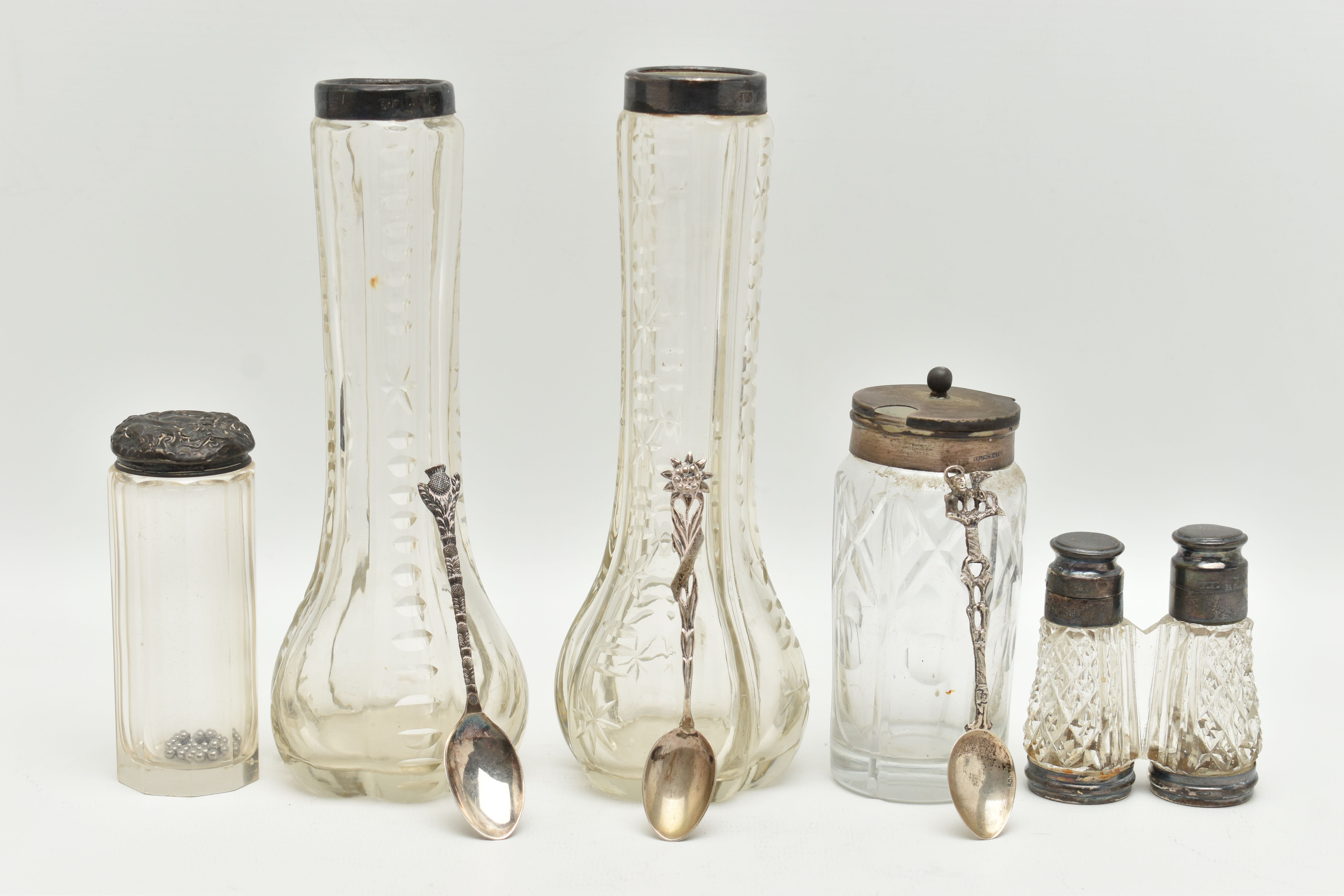 A SELECTION OF SILVER TOPPED GLASS ITEMS, to include a novelty salt and pepper shaker, designed as