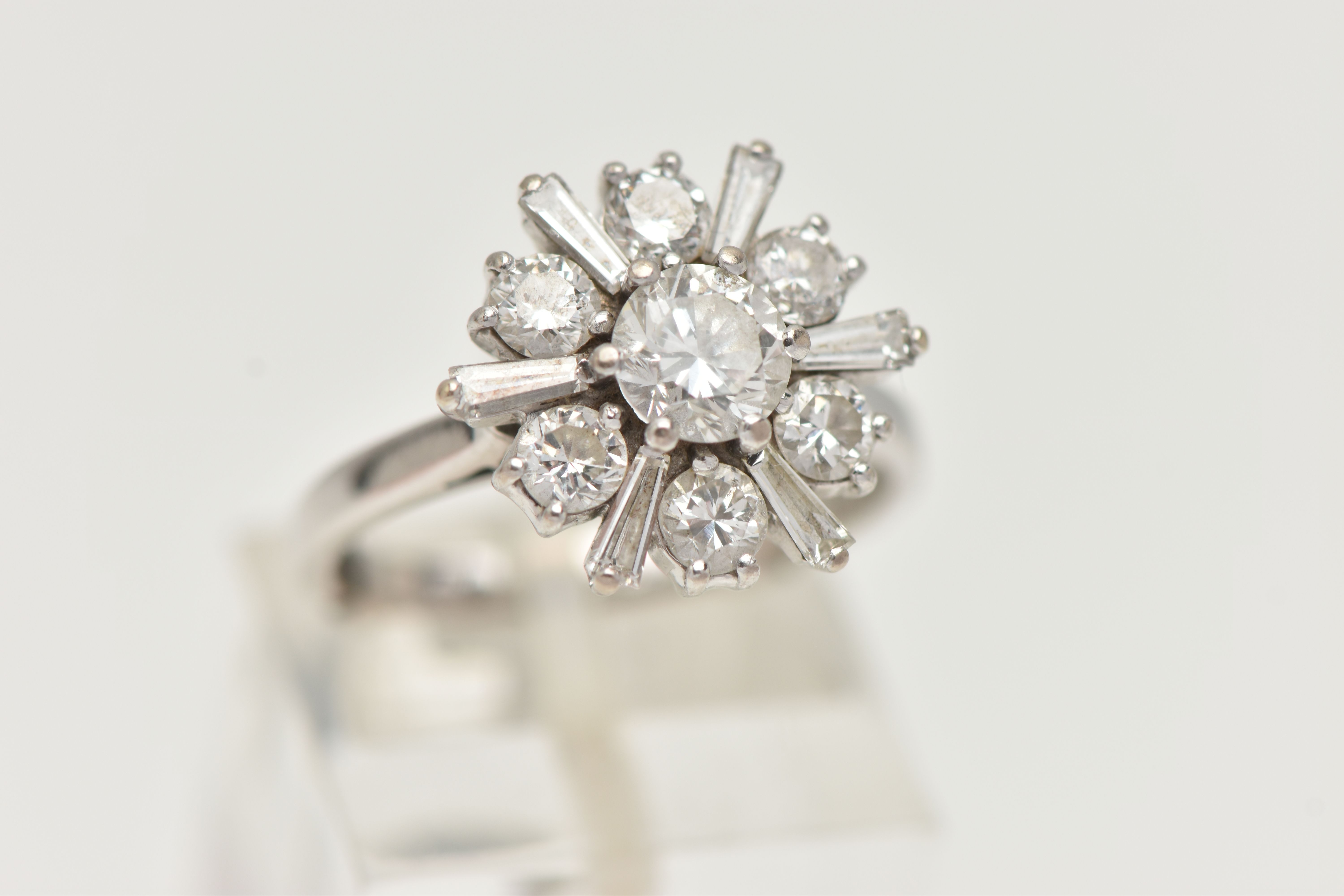 AN 18CT WHITE GOLD DIAMOND CLUSTER RING, centering on a round brilliant cut diamond, estimated - Image 4 of 4