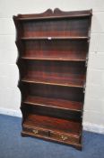 A SIX TIER STAINED PINE WATERFALL BOOKCASE, with two drawers, width 95cm x depth 38cm x height 181cm