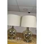 TWO MODERN TABLE LAMPS, with glass bodies and wheat coloured shades, height to top of fitting