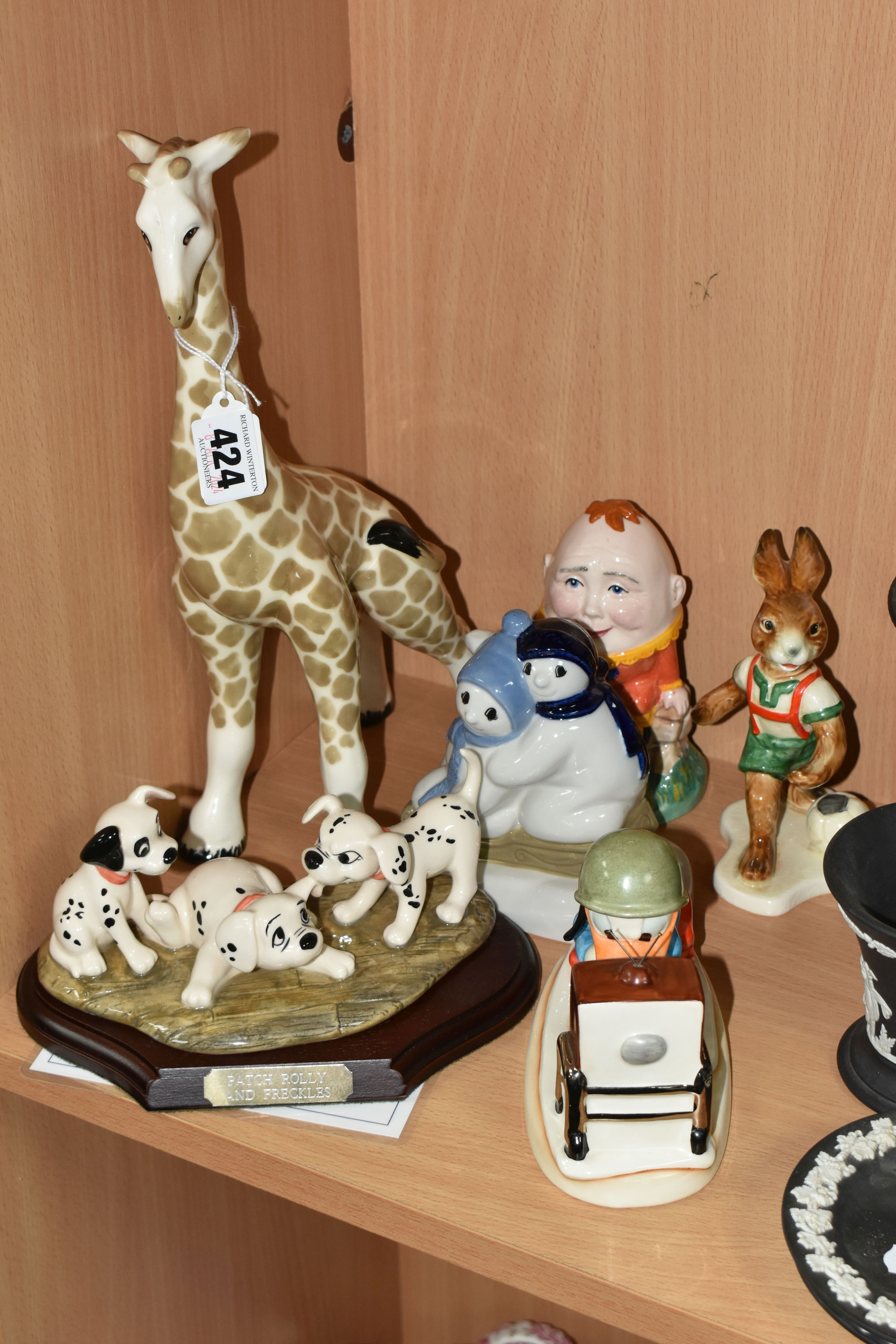 SIX ROYAL DOULTON, WADE, GOEBEL AND OTHER FIGURES, comprising a Royal Doulton 'Disney's 101