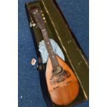 A CASED EARLY 20TH CENTURY MARIO CASELLA MANDOLIN, eight strings, tortoiseshell sound hole,