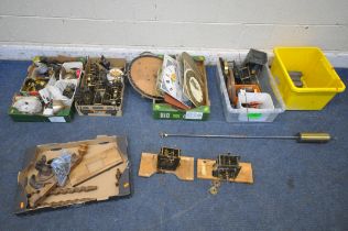 SIX TRAYS CONTAINING WATCHMAKERS TOOLS AND CLOCK PARTS, to include movements, weights, faces,