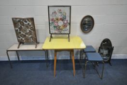 A YELLOW FORMICA DROP LEAF TABLE, two tubular metal stacking stools, two mirrors, two fire screens /