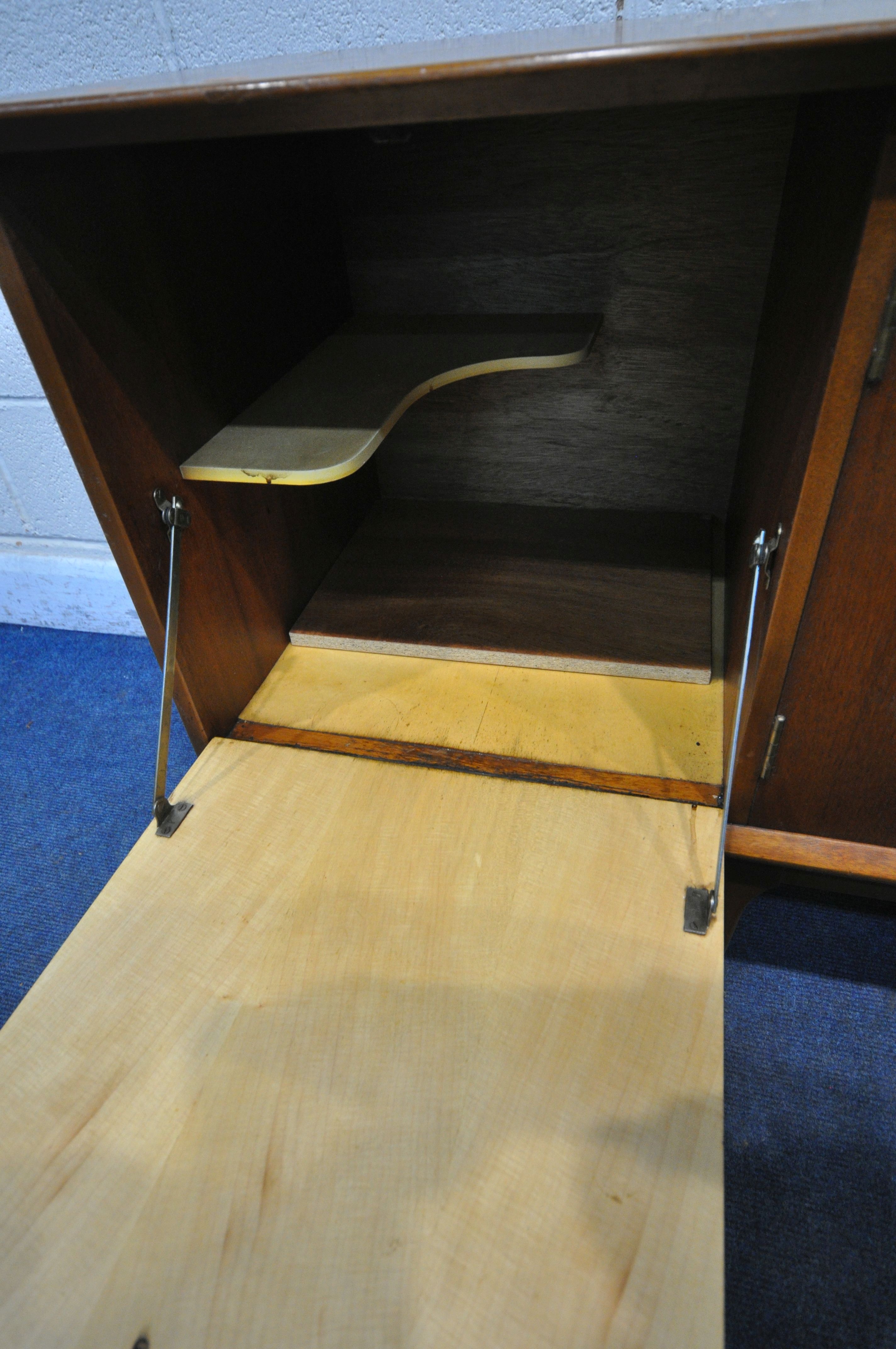 A MID CENTURY JENTIQUE TEAK SIDEBOARD, with three drawers, two cupboard doors and a fall front door, - Image 4 of 6