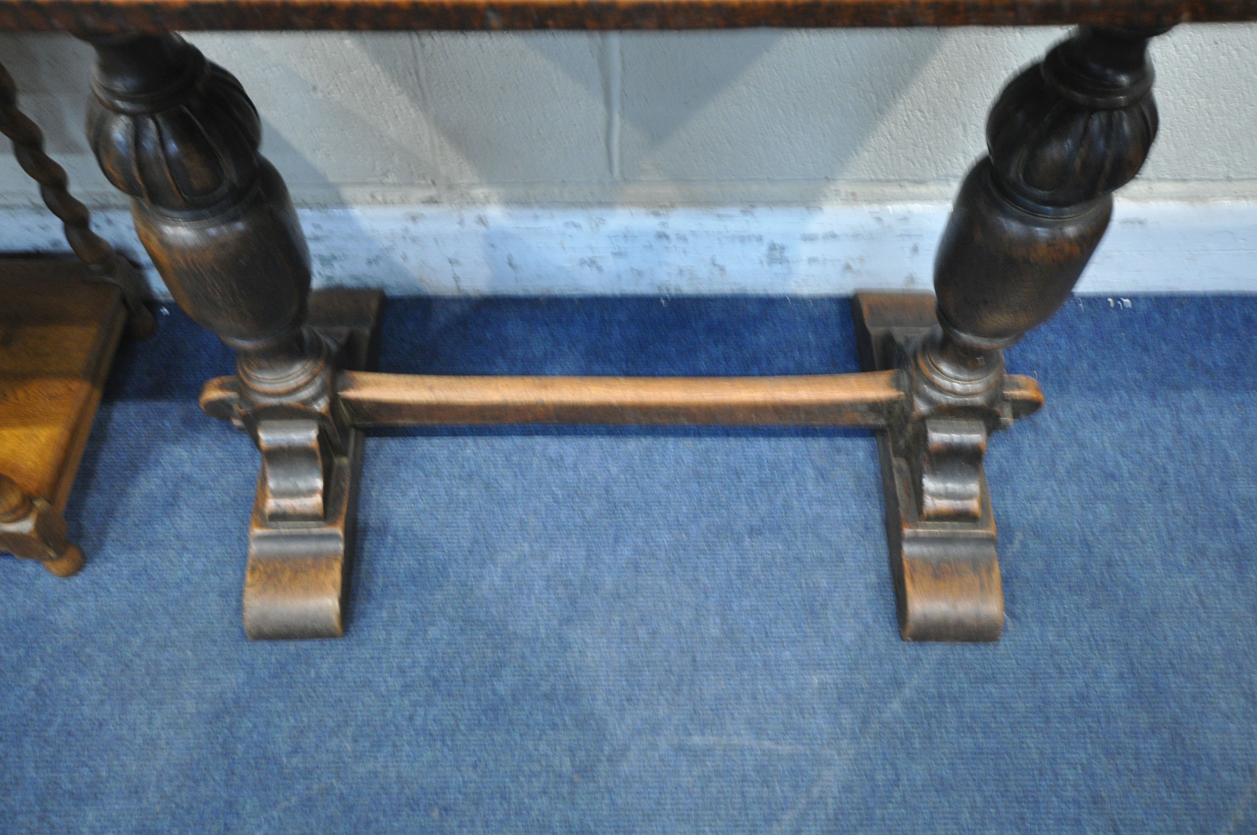 A 20TH CENTURY OAK SIDE TABLE, raised on bulbous turned supports, trestle style feet, united by a - Image 3 of 4