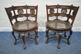 A PAIR OF REPRODUCTION HARDWOOD BURGERMEISTER CHAIRS, with foliate design to backrests, circular