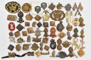 A BAG OF ASSORTED MILITARY CAP BADGES AND PINS, various designs, some with enamel detail, various