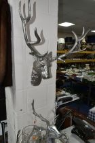FOUR PIECES OF STAG THEMED MODERN METALWARE, comprising two wall mounts, width of widest 56cm, a
