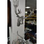 FOUR PIECES OF STAG THEMED MODERN METALWARE, comprising two wall mounts, width of widest 56cm, a