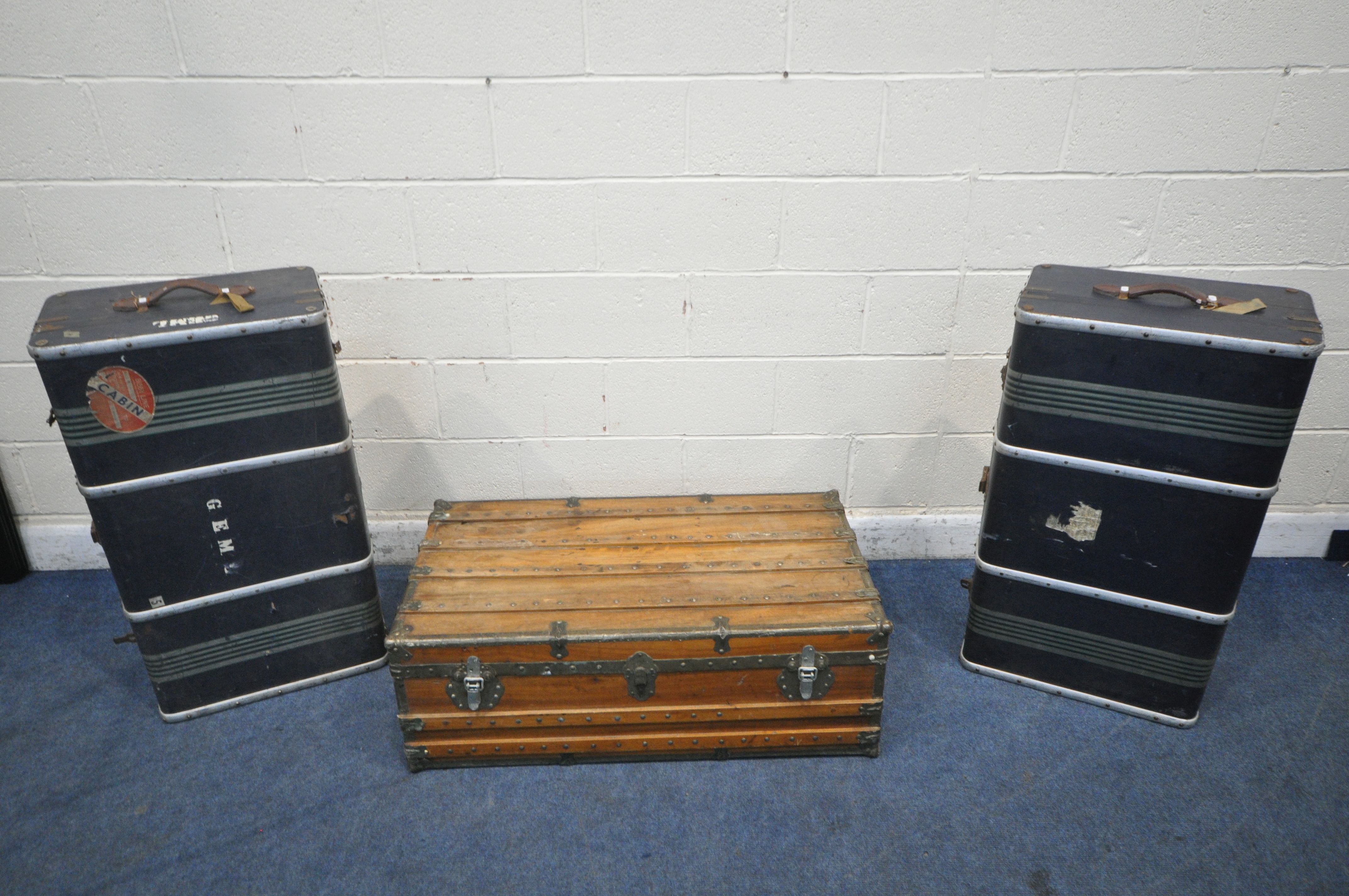 A METAL BANDED WOODEN TRUNK, with twin leather handles, width 101cm x depth 57cm x height 45cm,